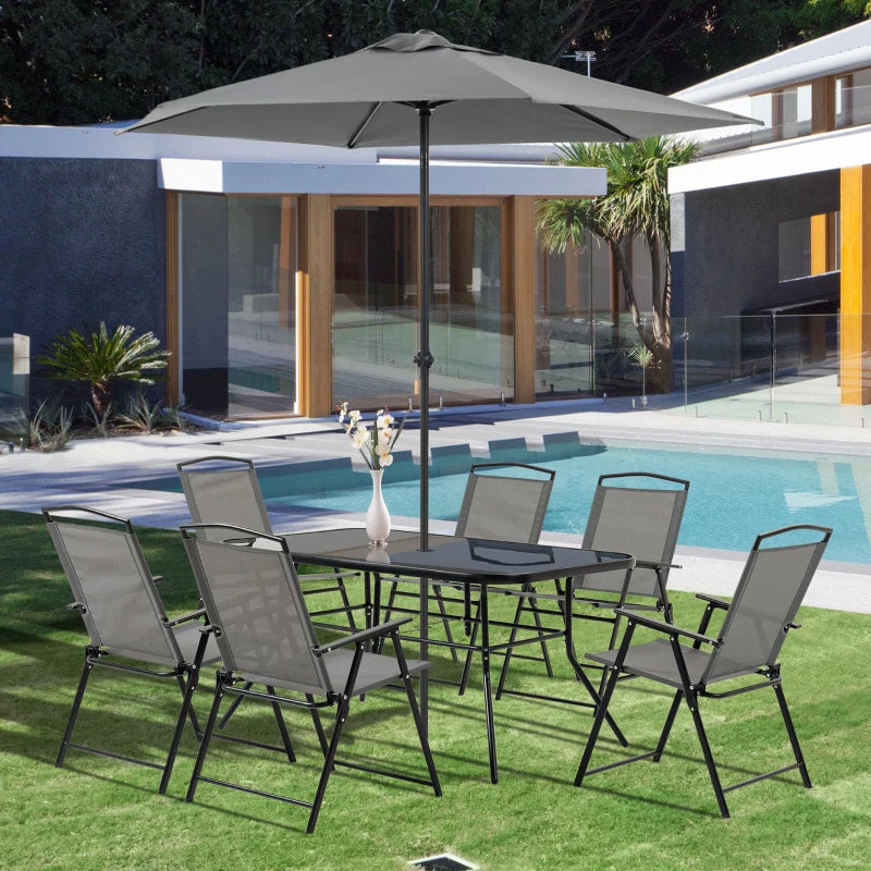 NEW 8pc Outdoor Dining Glass Table Set, 6 Folding Mesh Chairs, 7.5' Tilting Patio Umbrella, Grey